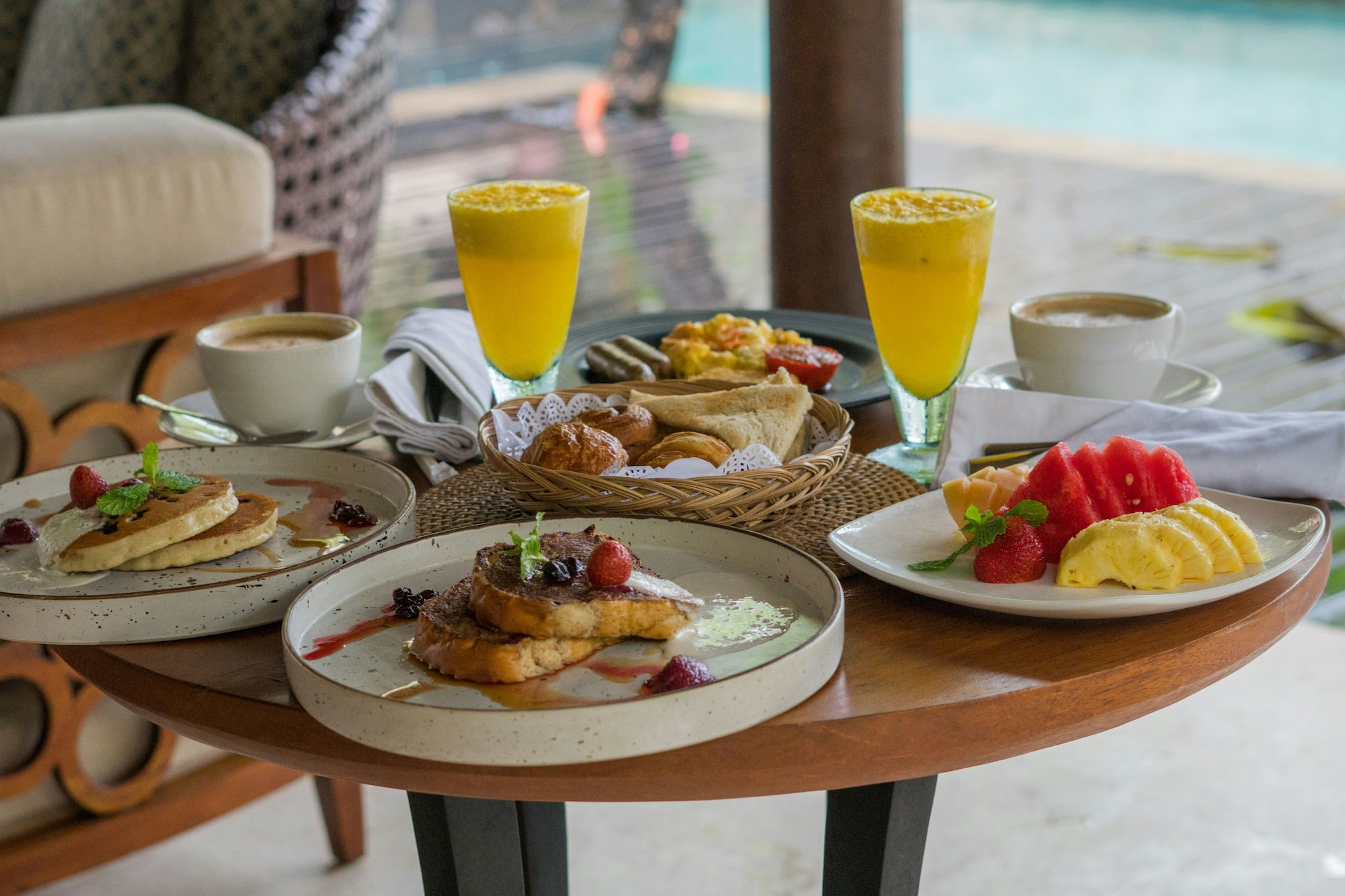 Complimentary hotel breakfast spread with fresh fruit, pastries, and juice